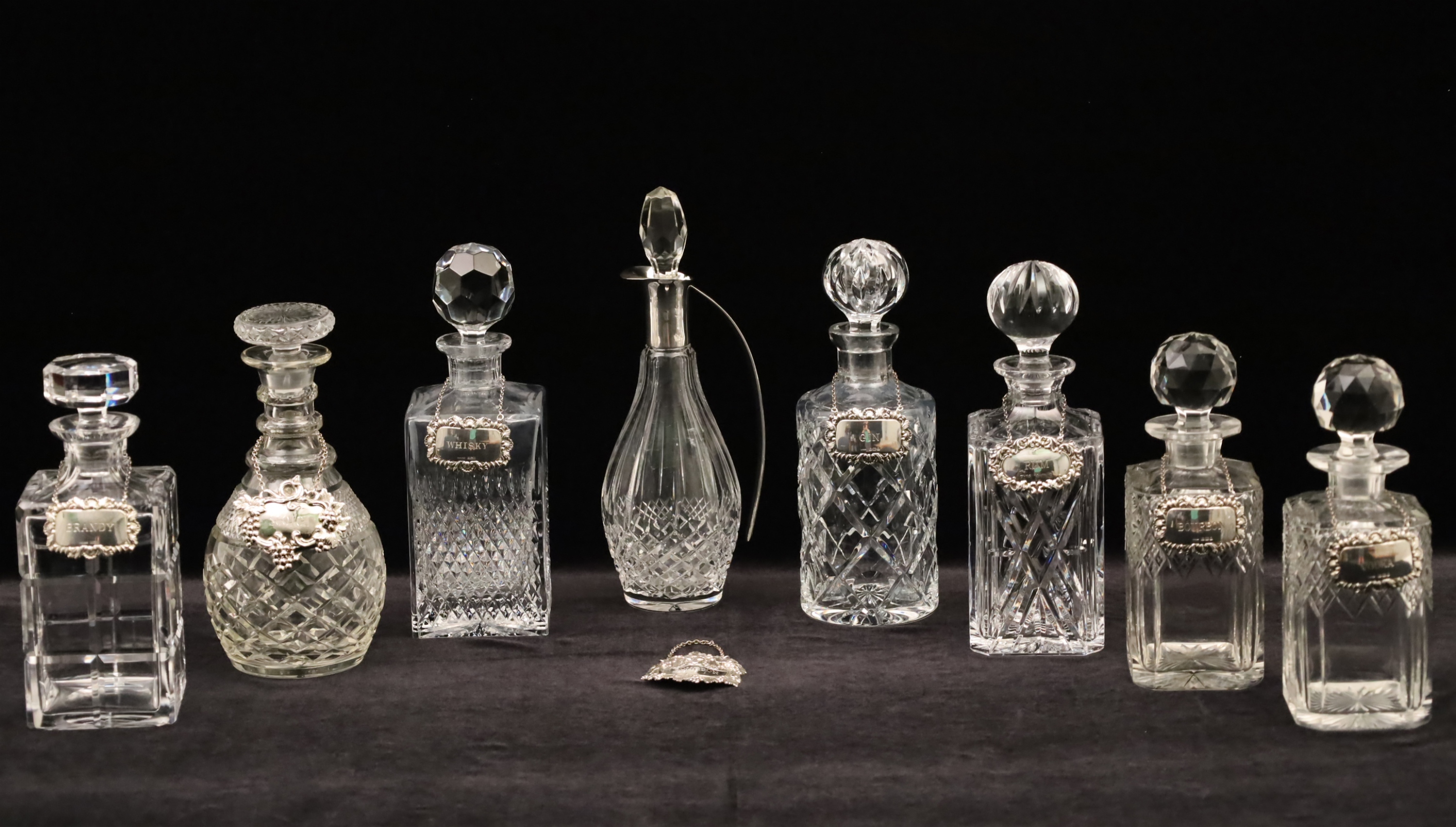 GROUP OF 8 CUT CRYSTAL WHISKY