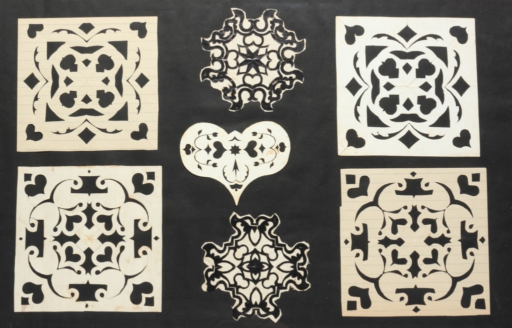GROUP OF AMERICAN PAPER CUT OUTS.