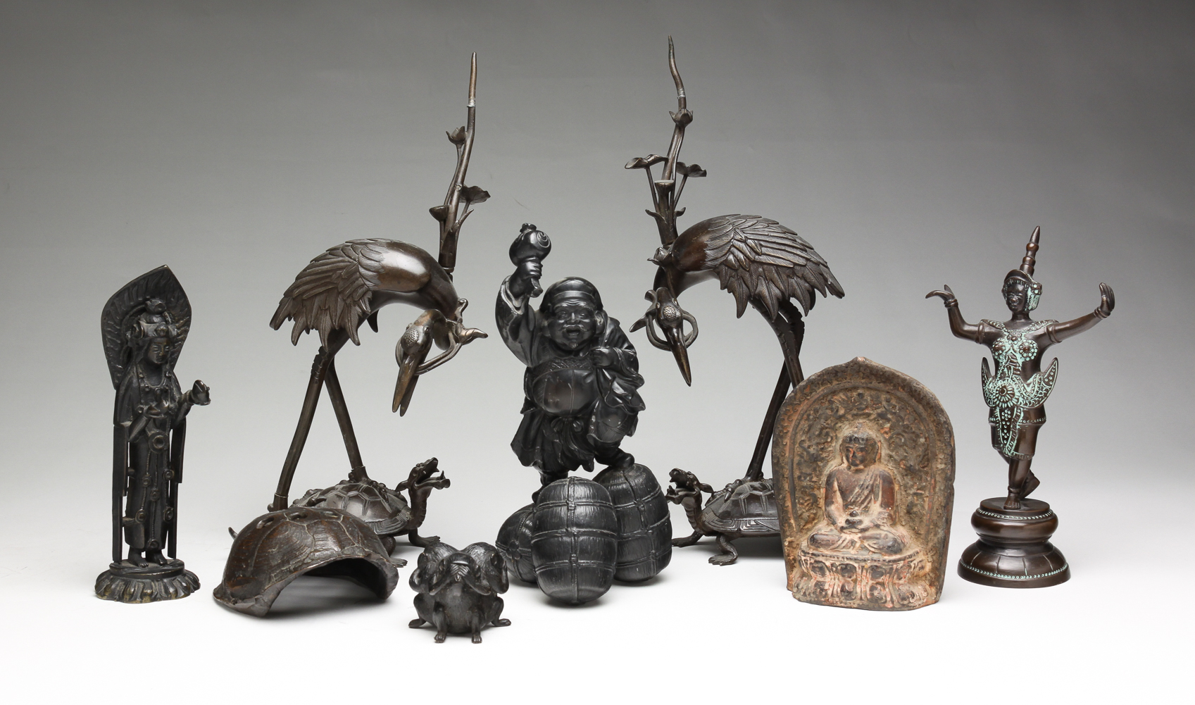 GROUP OF ASIAN FIGURES. Twentieth