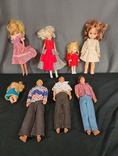 Group of Barbie, Ken and More.