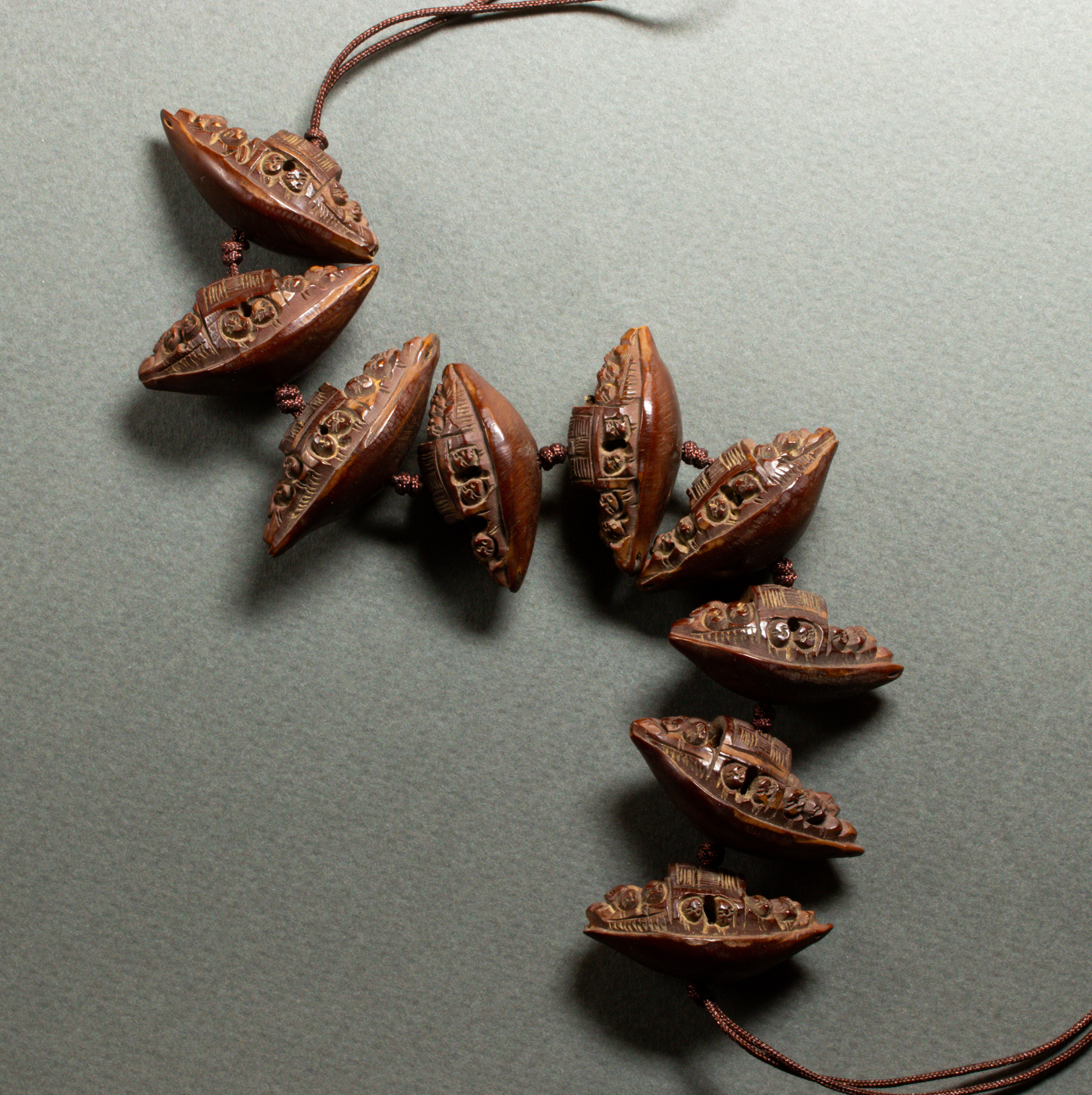 GROUP OF CARVED SEEDS Group of