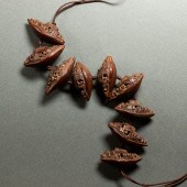 GROUP OF CARVED SEEDS Group of