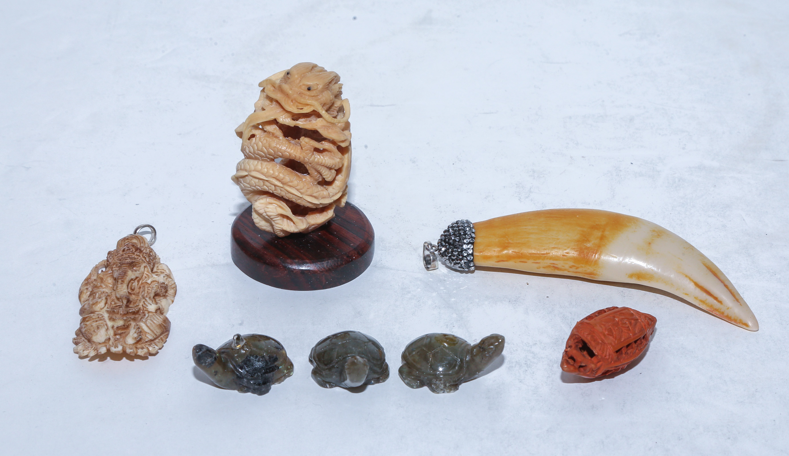 GROUP OF CARVINGS & PENDANTS