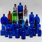 GROUP OF COLORED GLASS BOTTLES