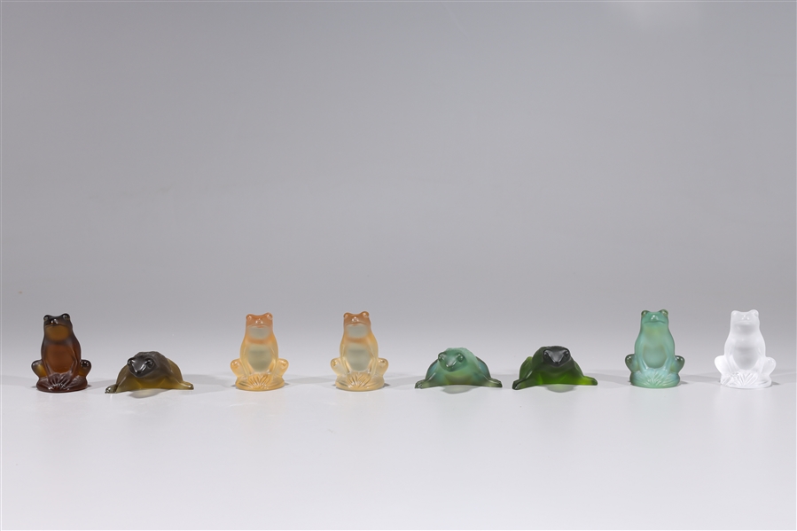 Group of eight Lalique glass frogs,