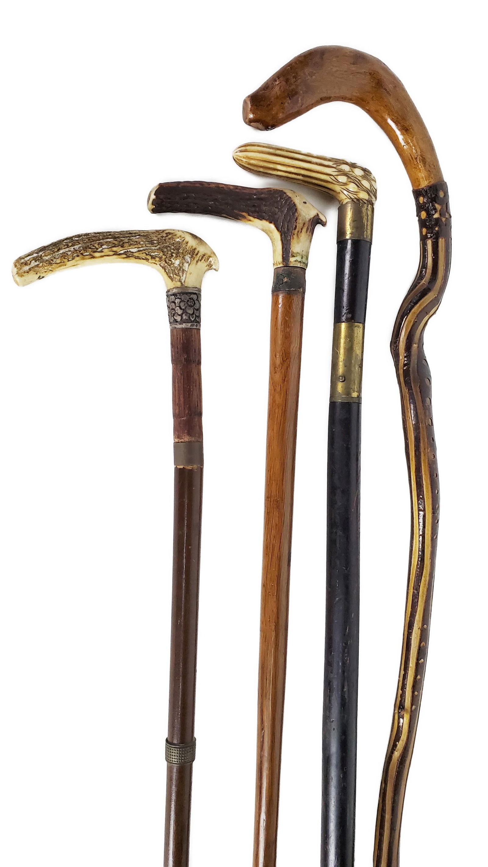 GROUP OF FOUR ANTIQUE CANES TO