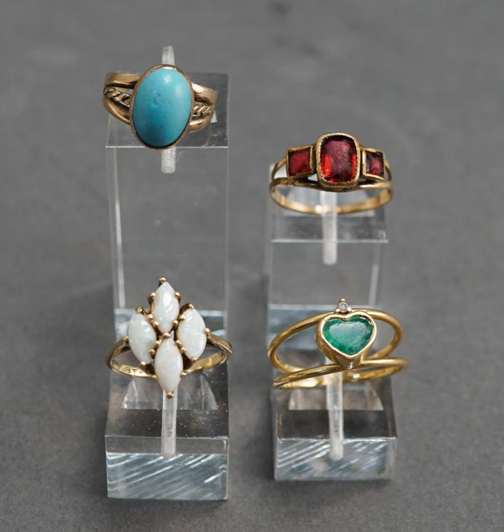 GROUP OF FOUR COLORED STONE MOUNTED