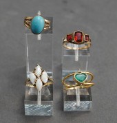 GROUP OF FOUR COLORED STONE MO