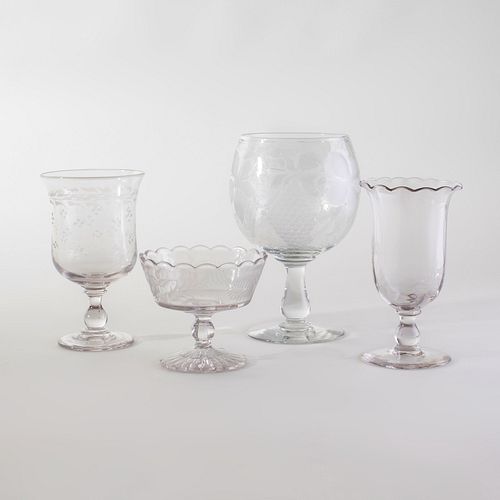 GROUP OF FOUR COLORLESS GLASS TABLE