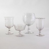 GROUP OF FOUR COLORLESS GLASS