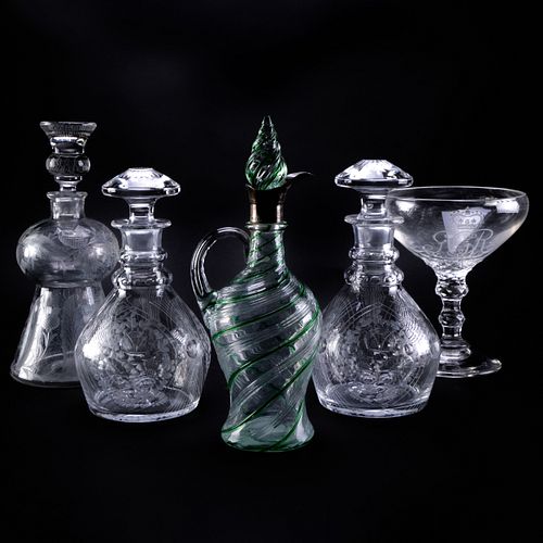 GROUP OF FOUR CUT GLASS DECANTERS