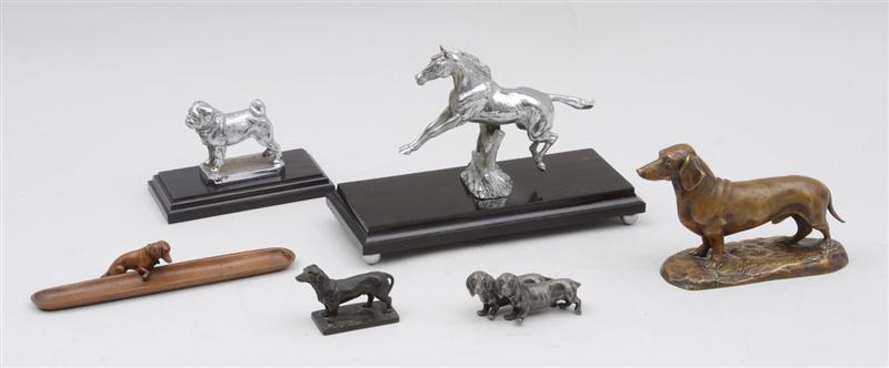 GROUP OF FOUR METAL DACHSHUNDS A