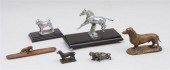 GROUP OF FOUR METAL DACHSHUNDS