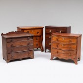 GROUP OF FOUR MINIATURE SALESM