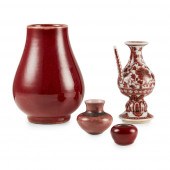 GROUP OF FOUR RED-GLAZED PORCE