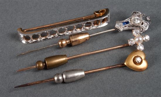 Group of gold pins including: 1)