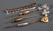 Group of gold pins including: