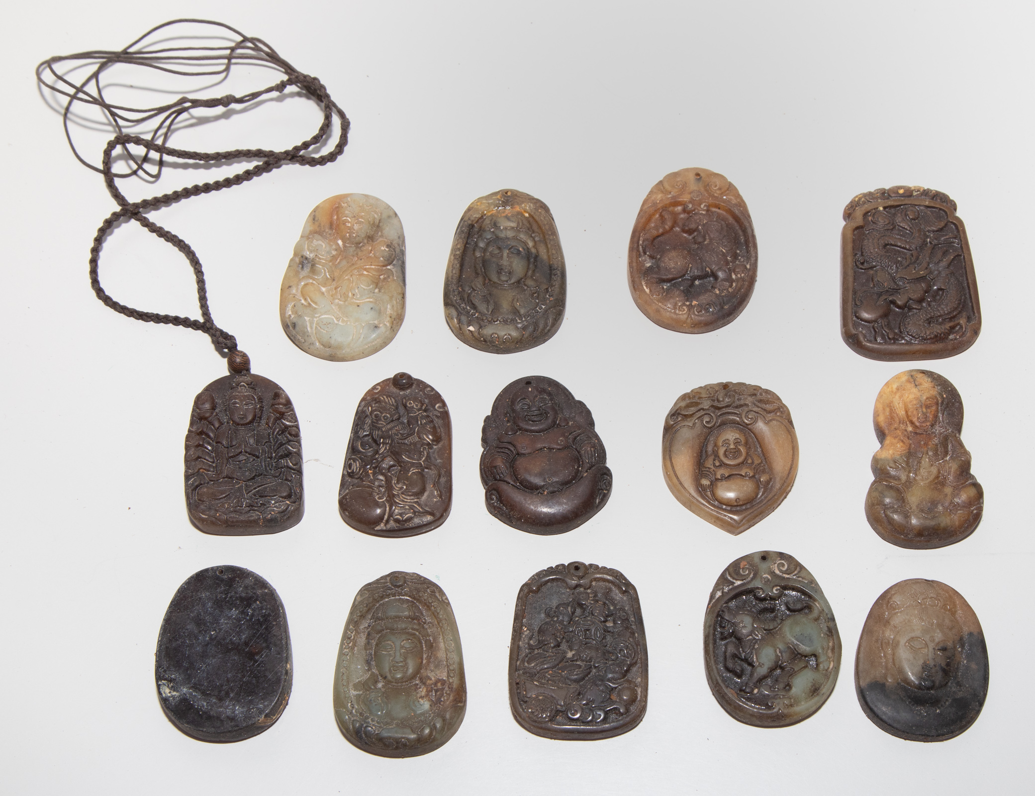 GROUP OF HARDSTONE PENDANTS .