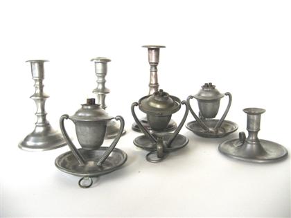 Group of pewter candlesticks and