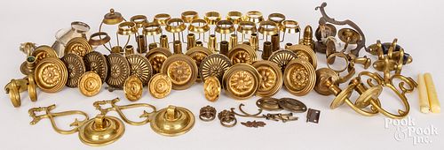 GROUP OF PRESSED BRASS TIEBACKS,