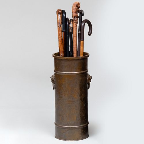 GROUP OF SEVEN WOODEN CANES AND A