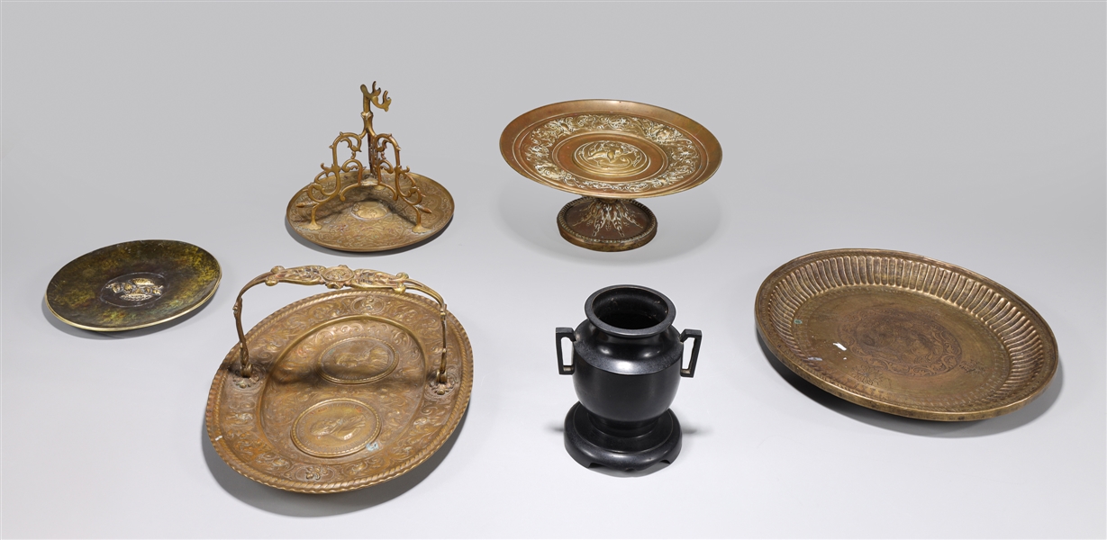 Group of six antique bronze plates,