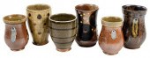 GROUP OF SIX MARK HEWITT CUPS(