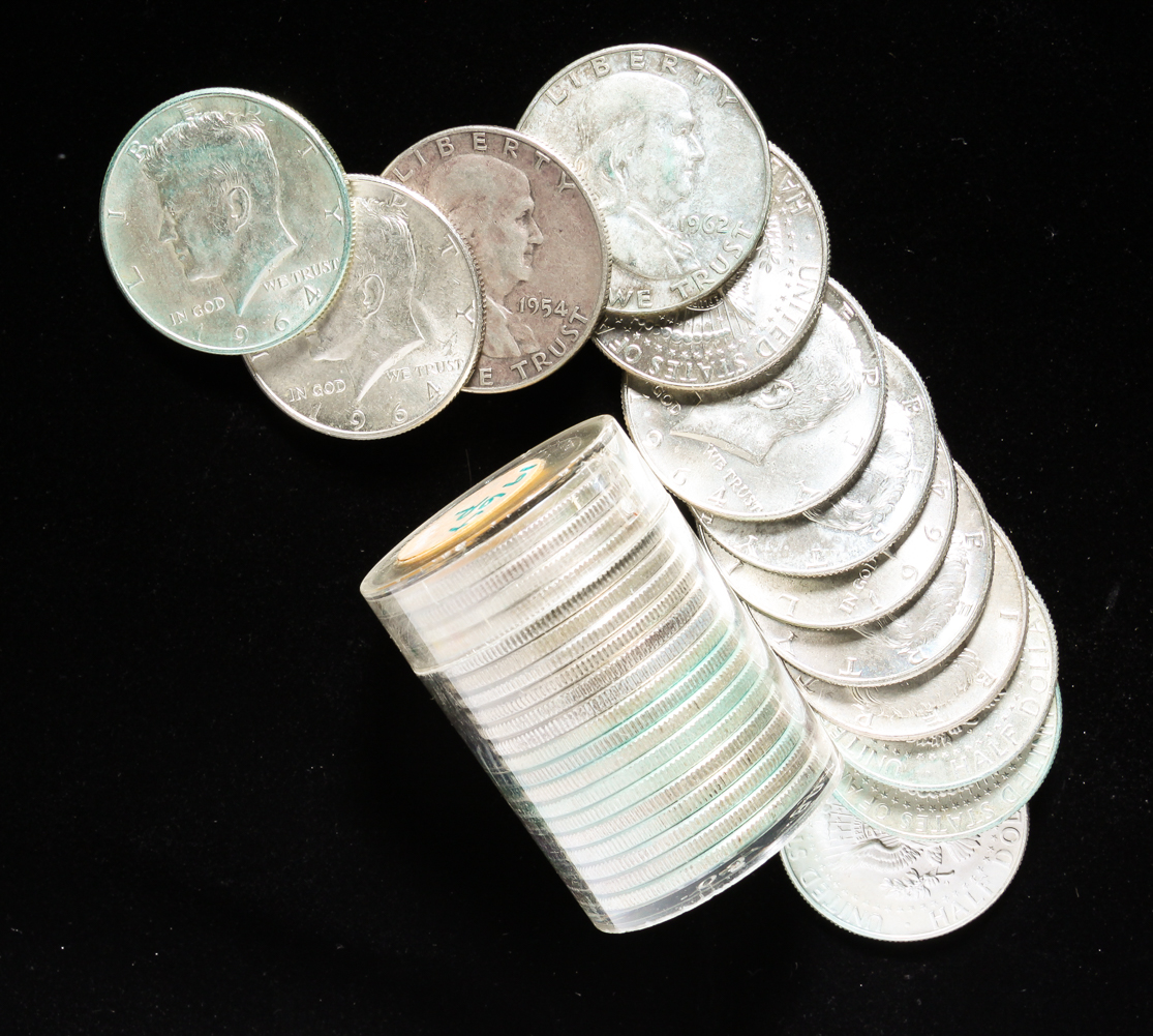 GROUP OF THIRTY-THREE SILVER HALF