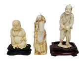 GROUP OF THREE CARVED FIGURES,