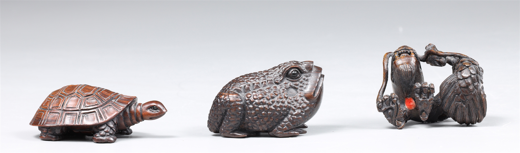 Group of three carved wood netuske,