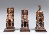 Group of three carved wood Don