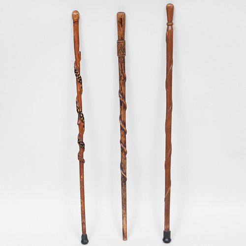 GROUP OF THREE CARVED WOOD CANESThe