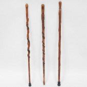 GROUP OF THREE CARVED WOOD CAN