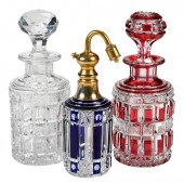 GROUP OF THREE CUT GLASS BOTTL