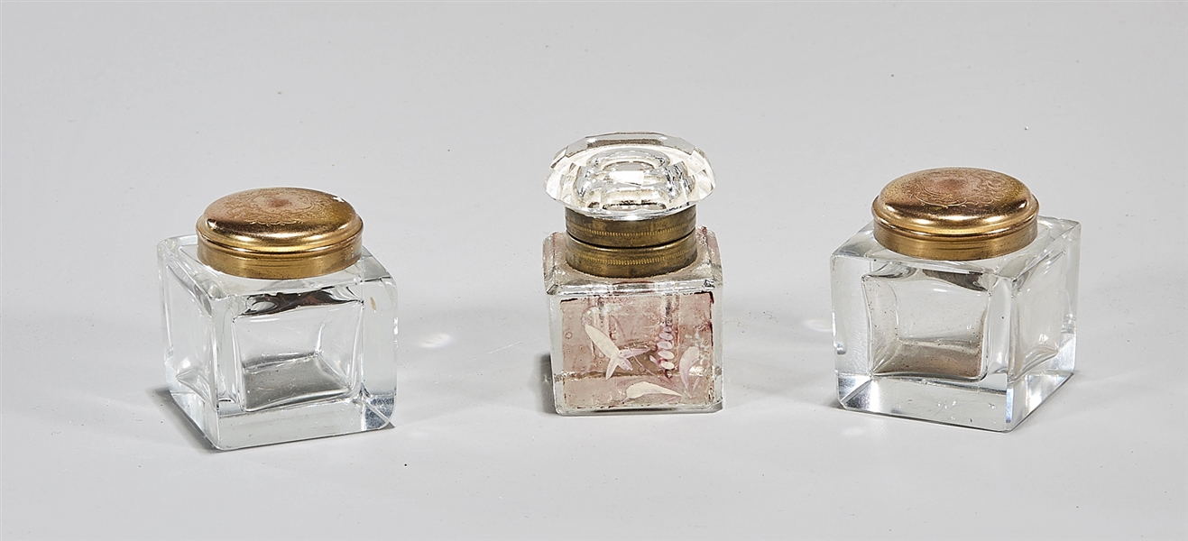 Group of three glass inkwells;