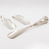 GROUP OF THREE SILVER SHOE HOR