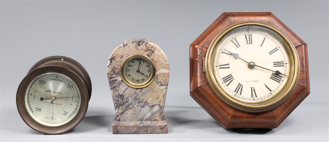 Group of threeclocks and barometer,