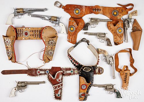 GROUP OF TOY CAP GUNS WITH HOLSTERS