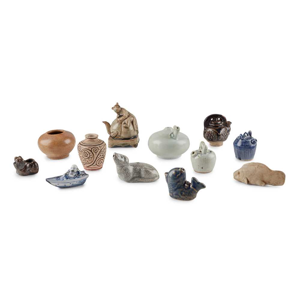 GROUP OF TWELVE WATER POTS AND