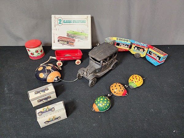 Group with Vintage tin toys and a