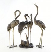 Grouping of bronze garden hero