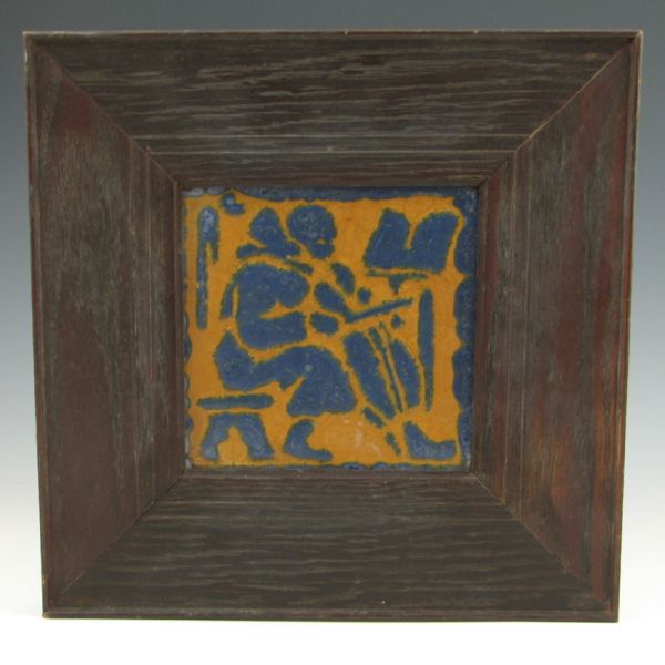 Grueby framed tile of a musician