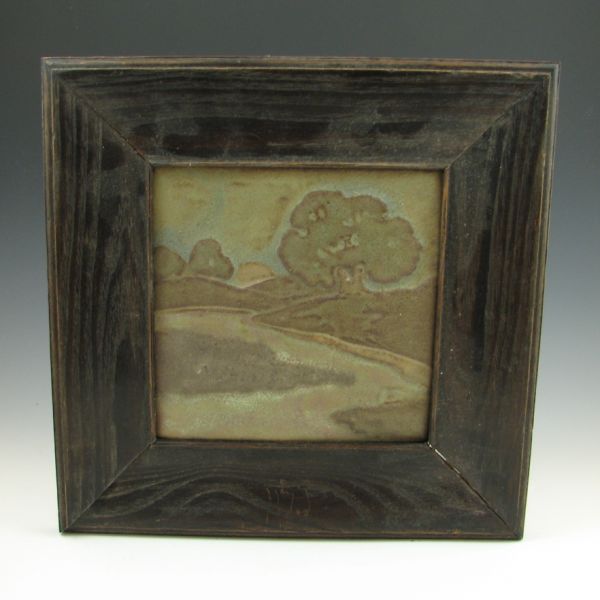 Gueby scenic tile in wood frame.
