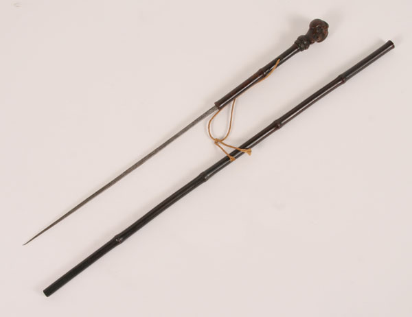 Gutta percha and bamboo figural