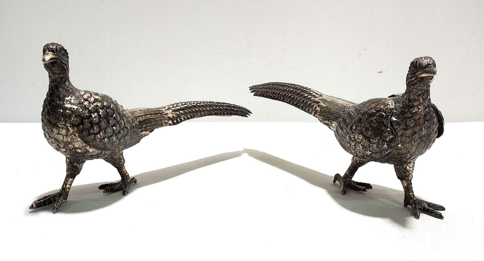 H106 A PAIR OF SILVER PLATE WALKING