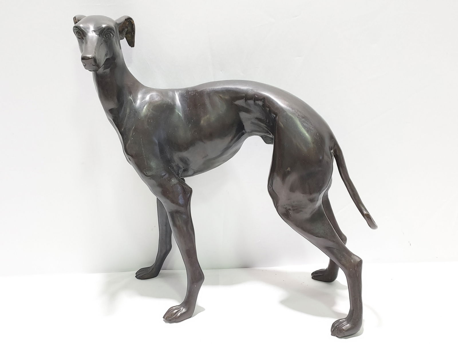 H174 BRONZE SCULPTURE OF A GREY