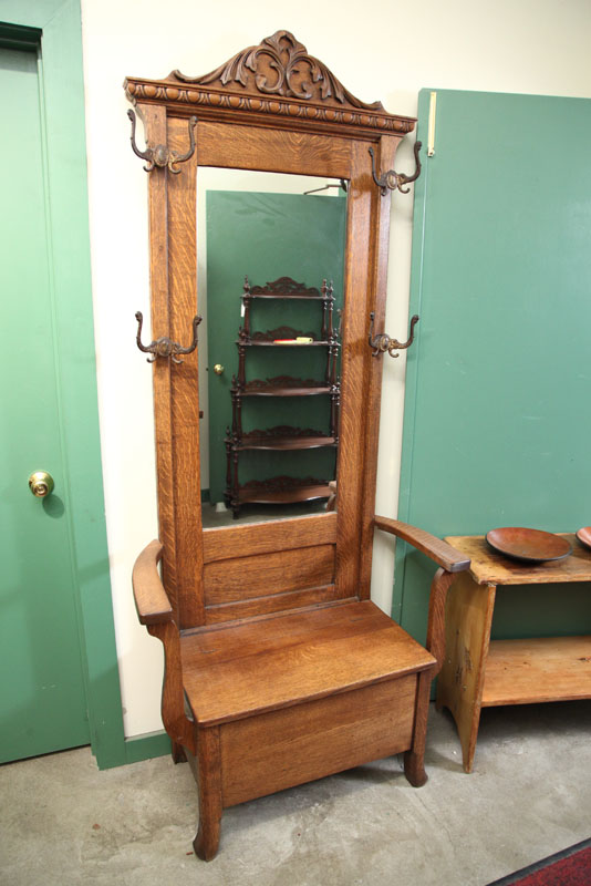 HALL SEAT. Oak with carved crest 