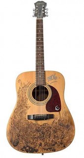 HAND-ENGRAVED ACOUSTIC GUITAR.