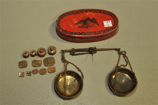 HAND SCALE. Gold scale having