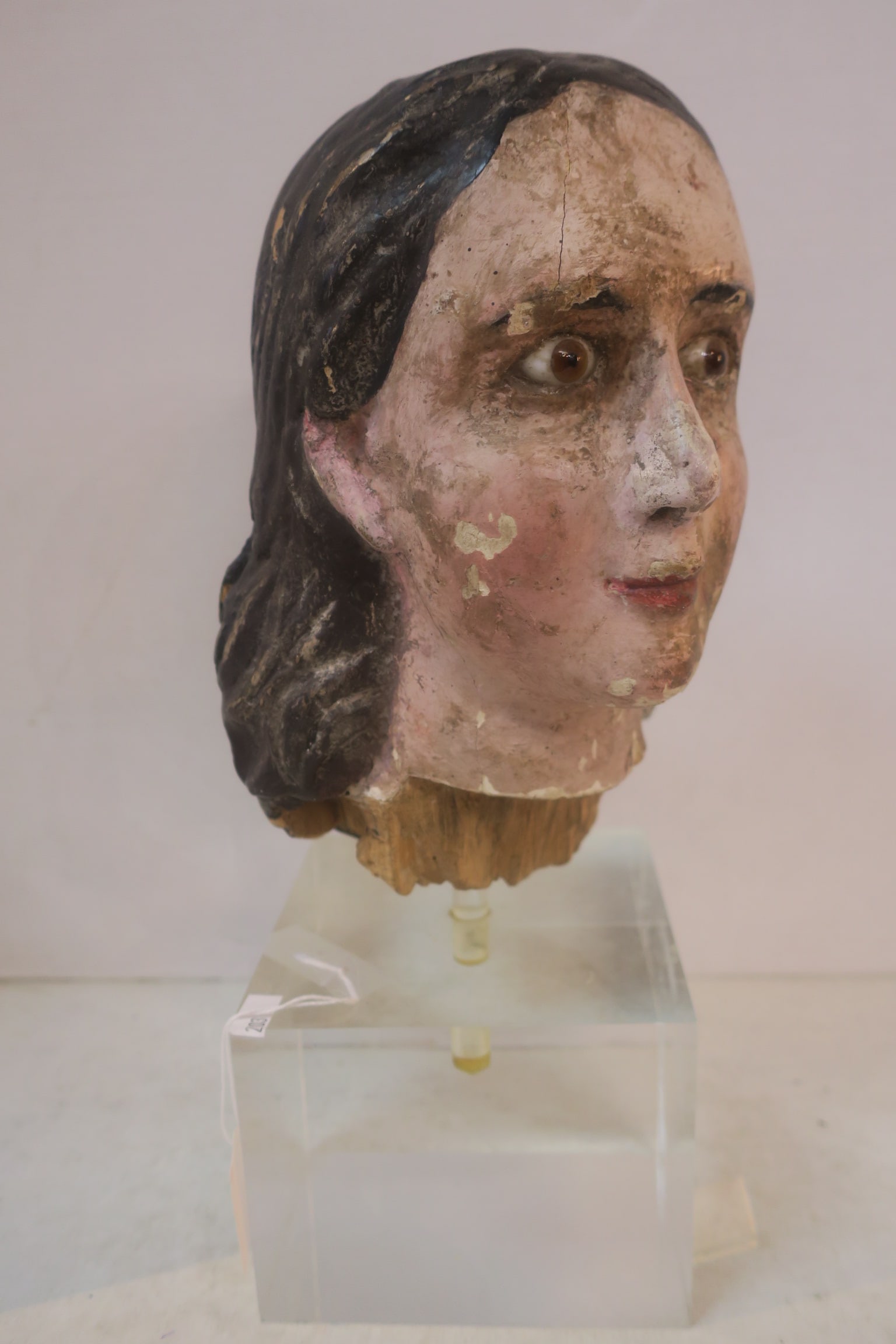 HEAD OF CARVED WOODEN SANTOS